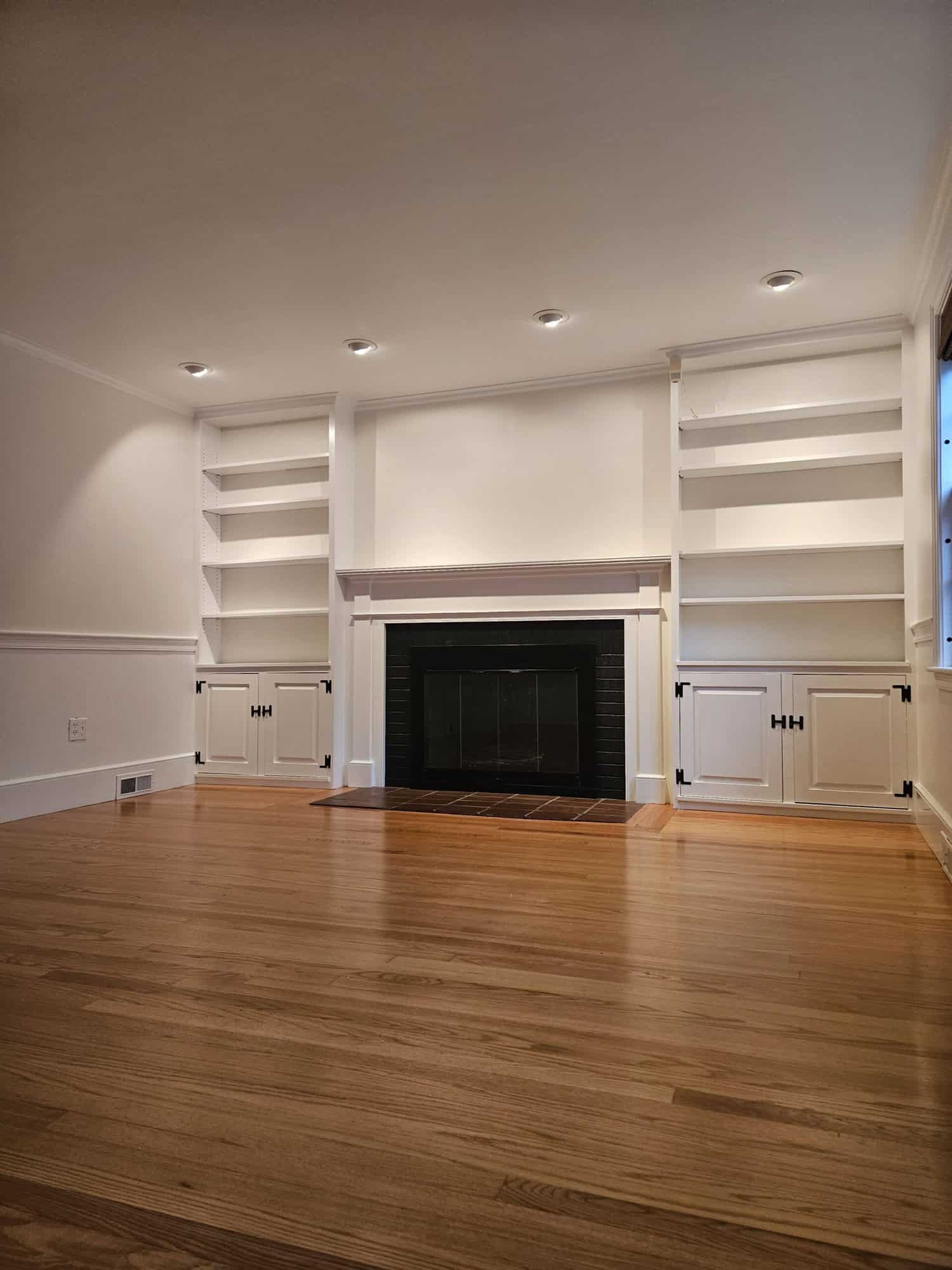 Pearl white interior walls with stained wooden floors