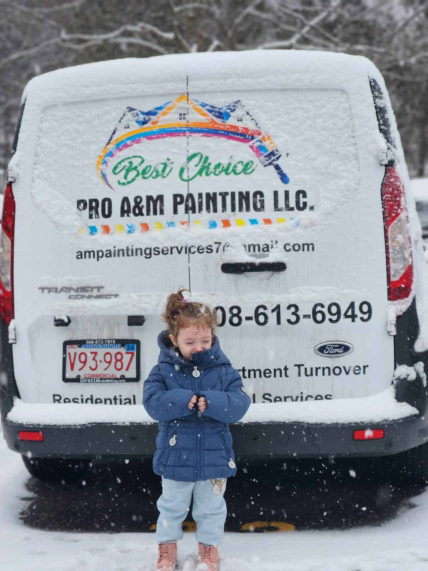 Princess! Cute little girl standing in snow. Company truck parked behind her.